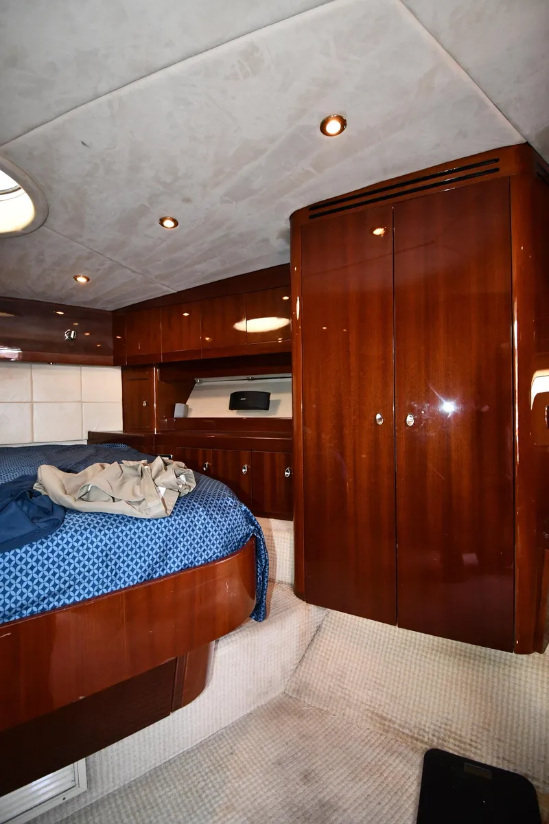 Slide: The Image of Luxurious cabin interior of 2008 Savannah 54 EXPRESS yacht with wooden finishes and cozy bedding. - 46