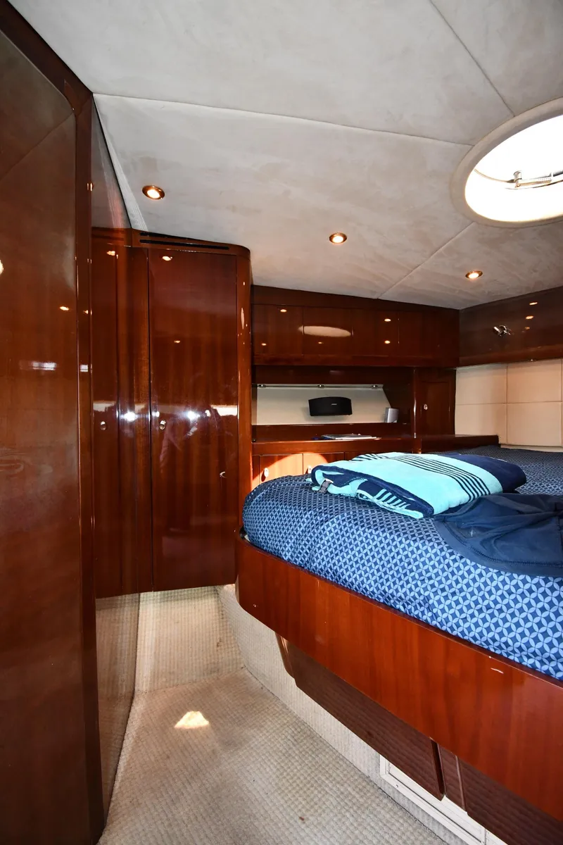 Slide: The Image of Luxurious cabin interior of 2008 Savannah 54 EXPRESS yacht with polished wood and cozy bedding. - 47