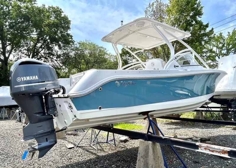 Slide: The Image of 2020 Edgewater 248 CX boat with Yamaha outboard engine on display stand. - 22