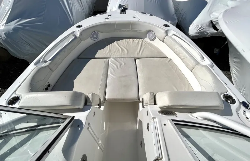 Slide: The Image of Bow seating area of 2020 Edgewater 348 CX boat with cushioned seats and speakers. - 8