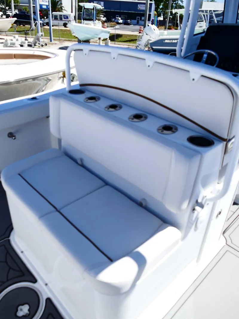 Slide: The Image of 2021 Sea Hunt Gamefish 27 boat interior with seating and rod holders. - 13