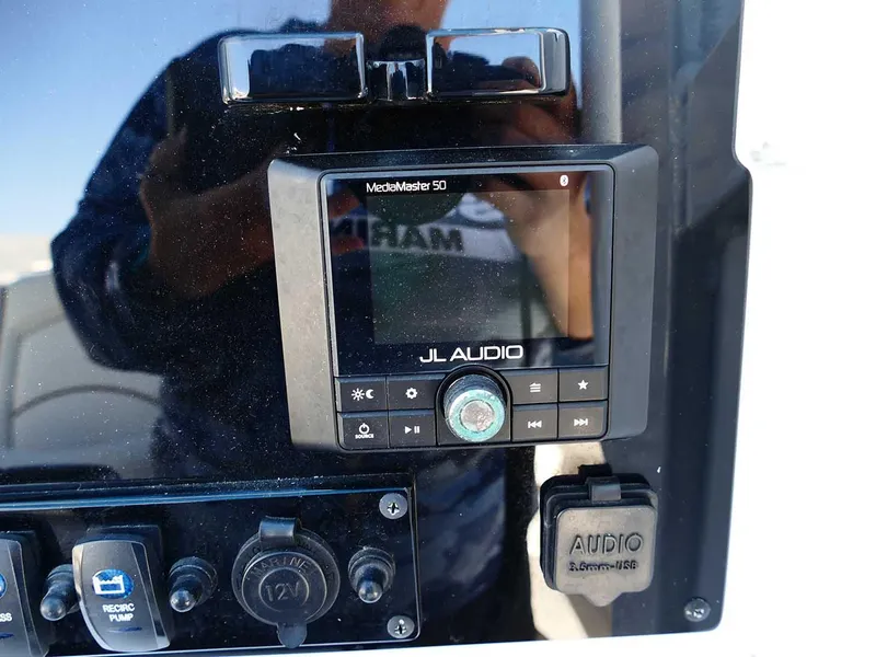 Slide: The Image of Control panel of 2021 Sea Hunt Gamefish 27 with JL Audio system. - 18