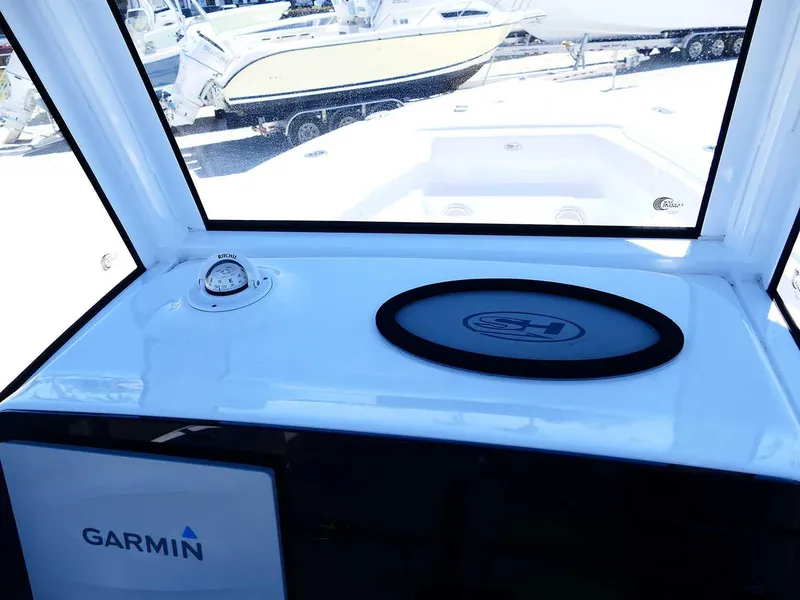 Slide: The Image of 2021 Sea Hunt Gamefish 27 dashboard with Garmin equipment and coffin box. - 22