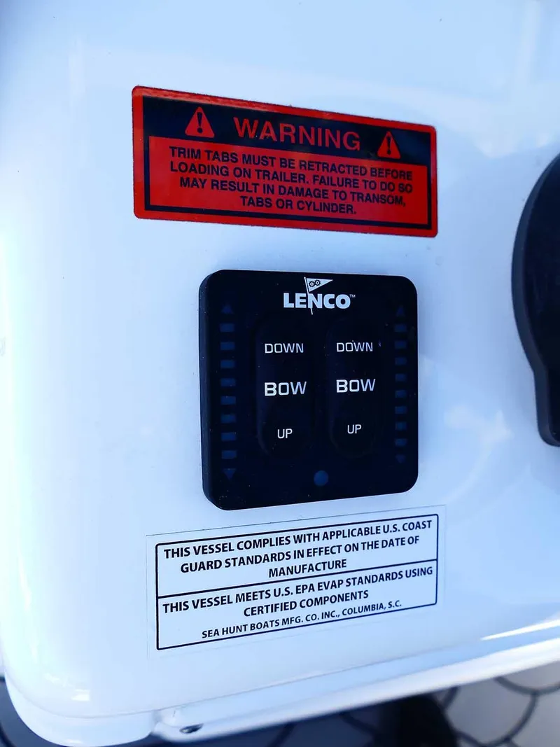 Slide: The Image of Control panel of a 2021 Sea Hunt Gamefish 27 with Coffin Box, featuring Lenco trim tab controls. - 23