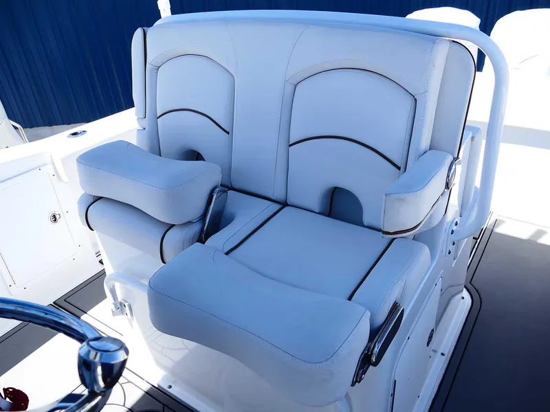 Slide: The Image of 2021 Sea Hunt Gamefish 27 boat seating with white cushioned seats and armrests. - 24