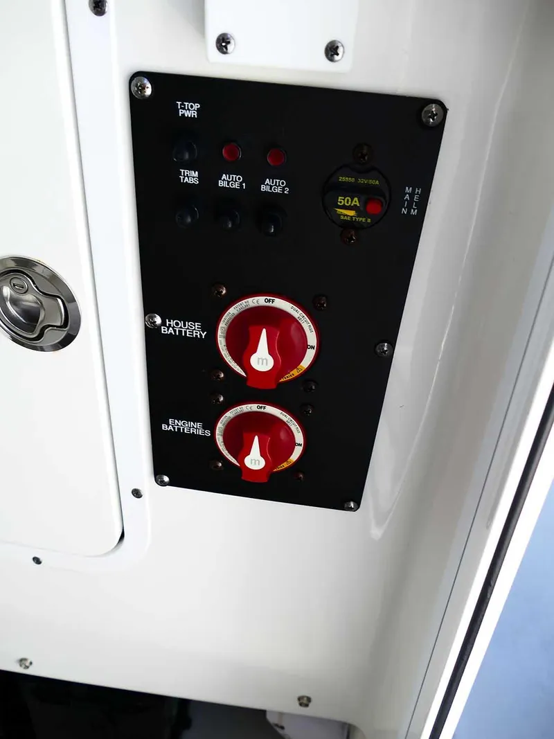 Slide: The Image of Control panel of 2021 Sea Hunt Gamefish 27 boat with battery switches and indicators. - 29