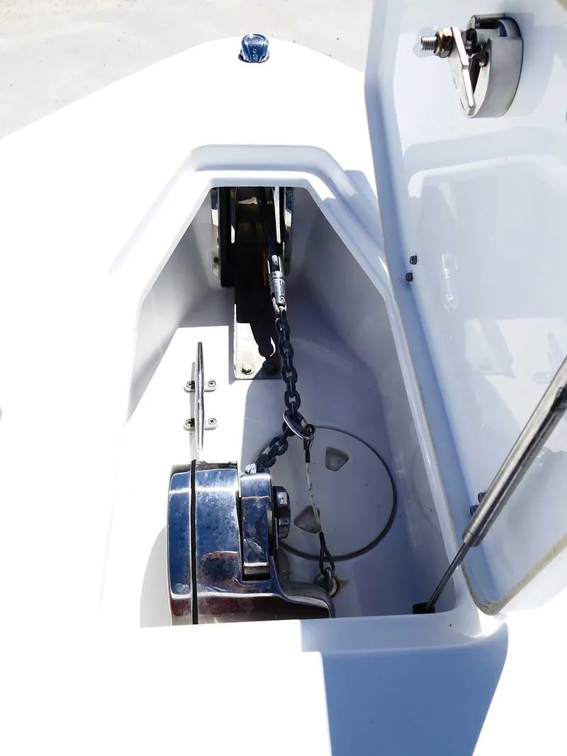 Slide: The Image of 2021 Sea Hunt Gamefish 27 anchor locker with chain and winch. - 32