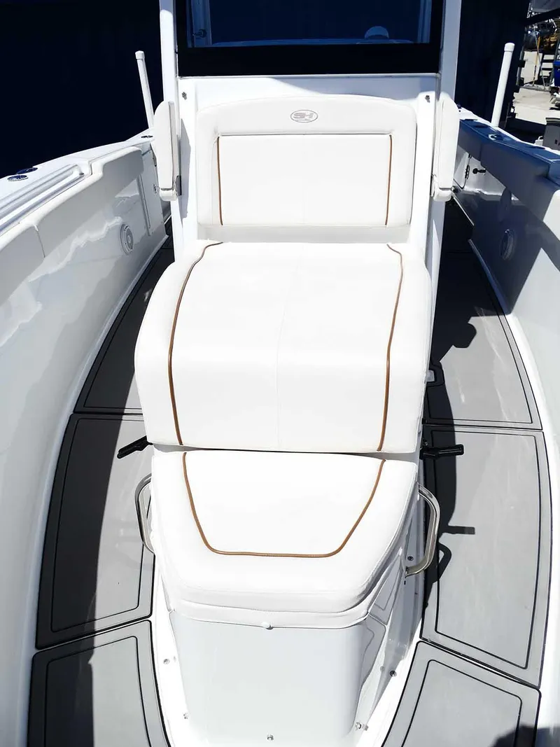 Slide: The Image of 2021 Sea Hunt Gamefish 27 with Coffin Box, featuring sleek white seating and modern design. - 33