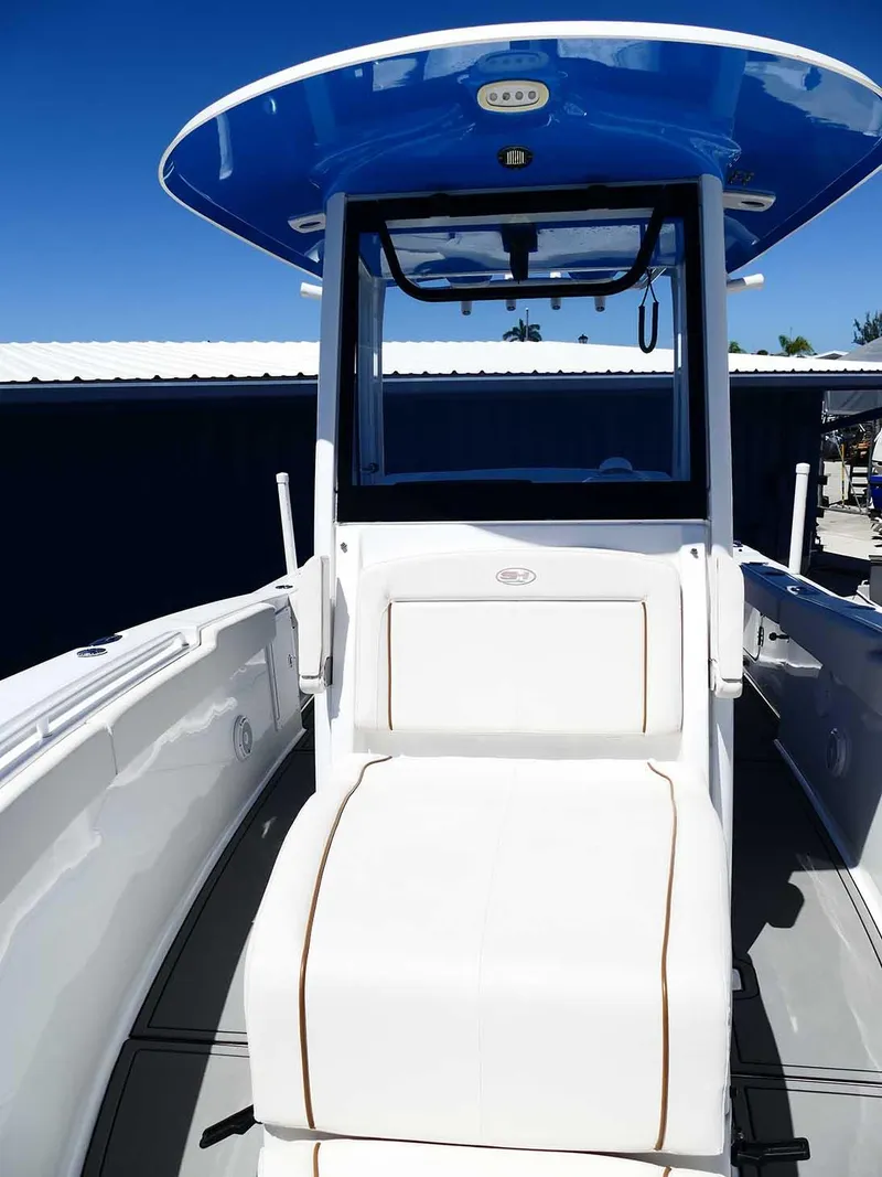 Slide: The Image of 2021 Sea Hunt Gamefish 27 with Coffin Box, featuring sleek design and blue T-top. - 34