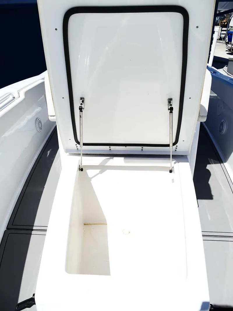 Slide: The Image of 2021 Sea Hunt Gamefish 27 Coffin Box open, showcasing spacious storage. - 35