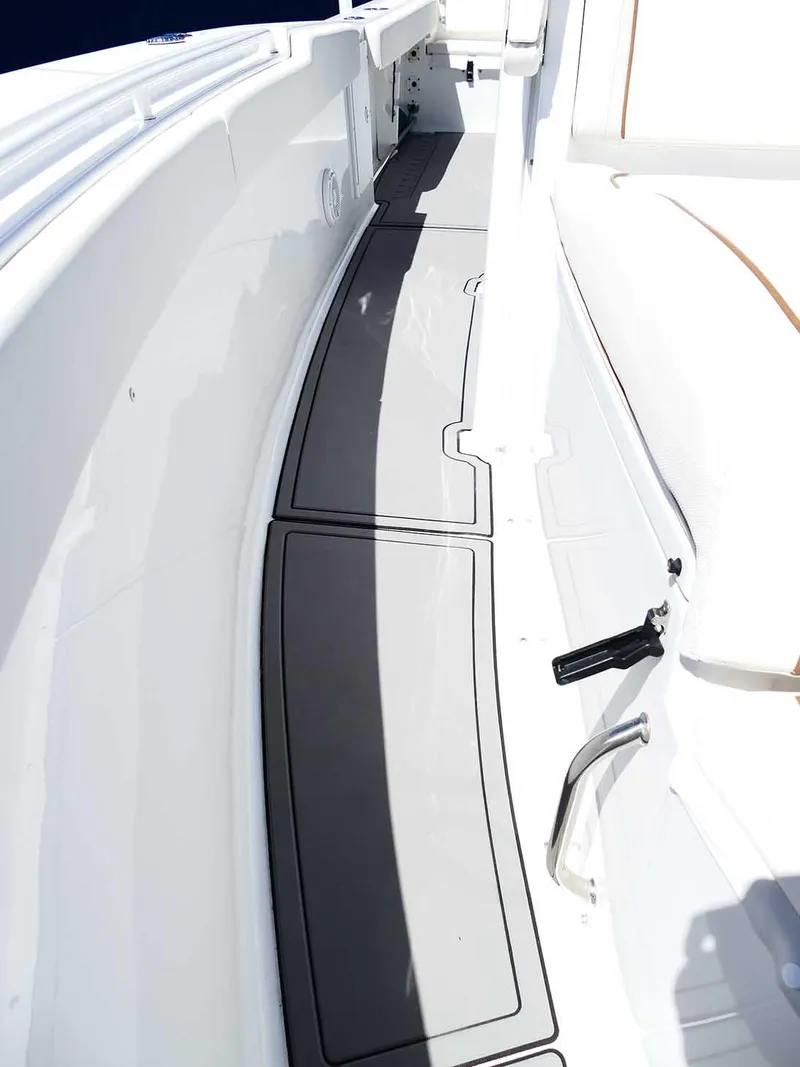 Slide: The Image of 2021 Sea Hunt Gamefish 27 boat deck with coffin box, featuring sleek design and spacious layout. - 36