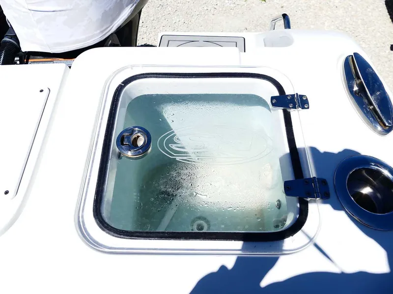 Slide: The Image of 2021 Sea Hunt Gamefish 27 livewell with transparent lid and secure latch. - 41