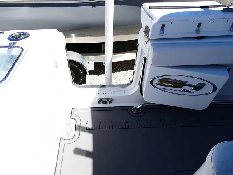 Slide: The Image of 2021 Sea Hunt Gamefish 27 boat interior with coffin box and measuring ruler. - 43