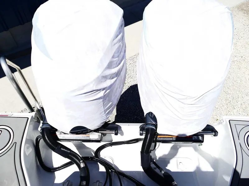 Slide: The Image of 2021 Sea Hunt Gamefish 27 boat engines covered, showcasing dual outboard motors. - 46