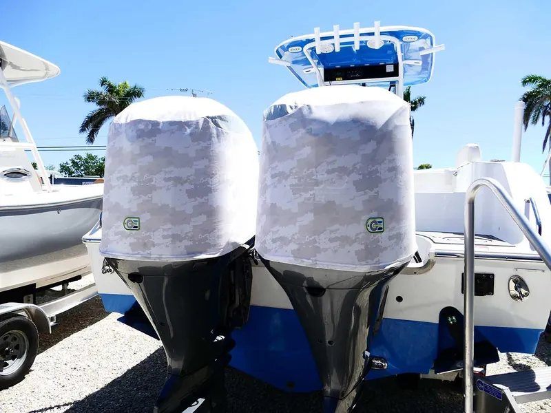 Slide: The Image of 2021 Sea Hunt Gamefish 27 boat with twin covered outboard motors. - 47