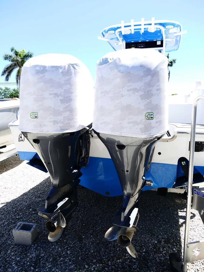 Slide: The Image of 2021 Sea Hunt Gamefish 27 boat with twin covered outboard motors. - 48