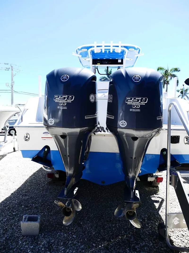 Slide: The Image of 2021 Sea Hunt Gamefish 27 with twin 250 HP engines, rear view. - 9