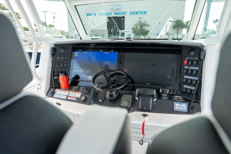 Slide: The Image of 2024 Blackfin 400 CC boat dashboard with advanced navigation system and controls. - 19