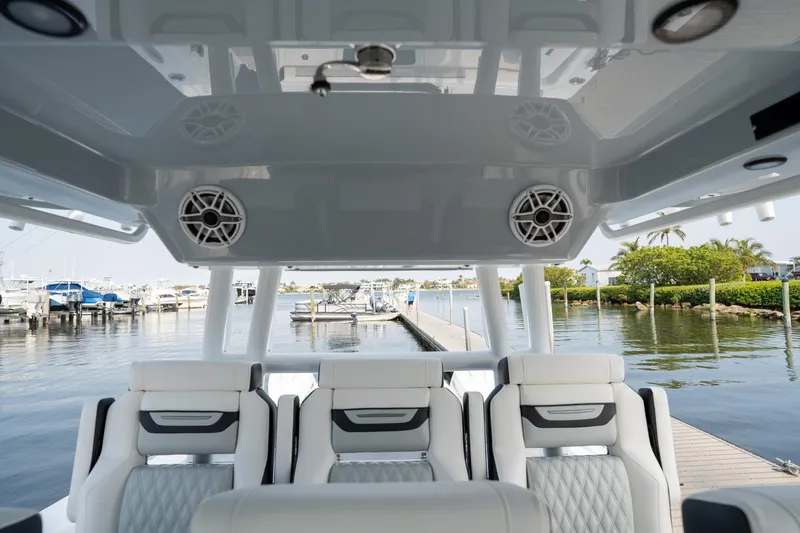 Slide: The Image of 2024 Blackfin 400 CC boat interior with luxurious seating and waterfront view. - 23