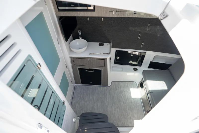 Slide: The Image of 2024 Blackfin 400 CC cabin interior with modern amenities and sleek design. - 29