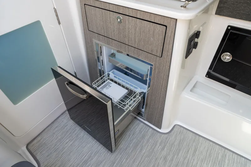 Slide: The Image of 2024 Blackfin 400 CC boat interior with open drawer and built-in appliance. - 41