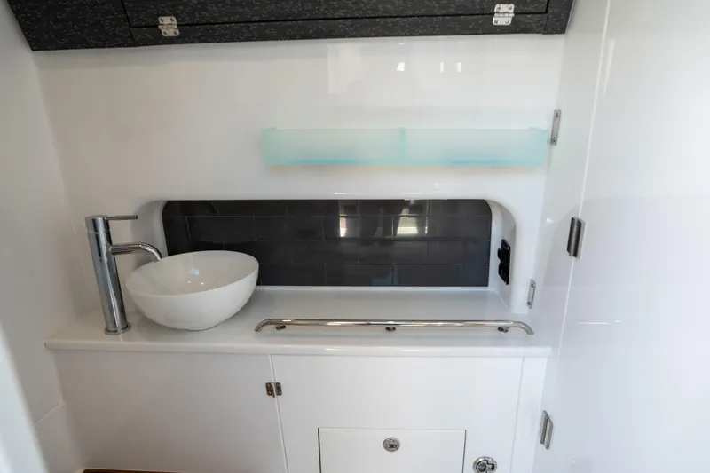 Slide: The Image of 2024 Blackfin 400 CC interior with modern sink and sleek cabinetry. - 47
