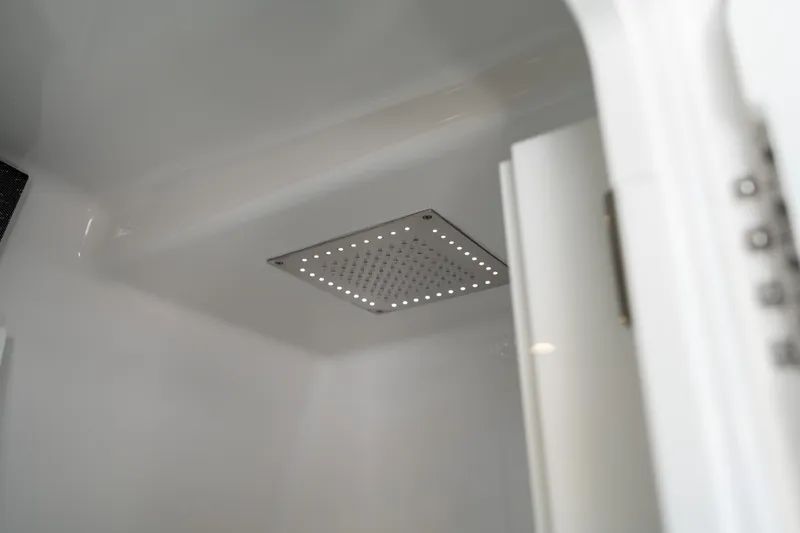 Slide: The Image of 2024 Blackfin 400 CC cabin interior with modern ceiling light fixture. - 50