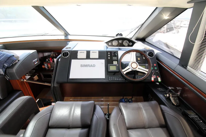Slide: The Image of Cockpit of 2013 Princess V62 yacht with leather seats and advanced navigation system. - 30