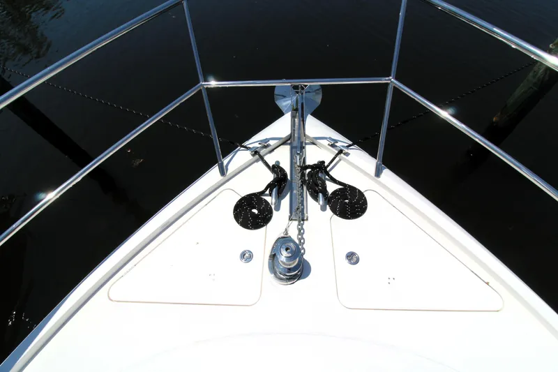 Slide: The Image of Bow of 2013 Princess V62 yacht with anchor and railing, viewed from above. - 33