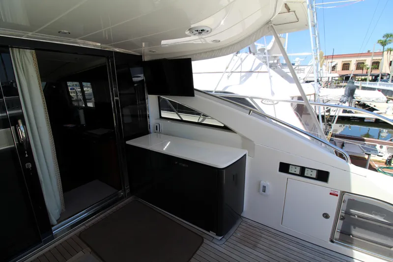 Slide: The Image of Luxury yacht deck area on 2013 Princess V62, featuring sleek design and modern amenities. - 40