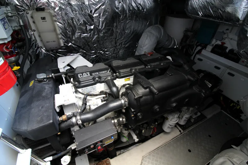 Slide: The Image of Engine room of a 2013 Princess V62 yacht, featuring a CAT engine. - 45