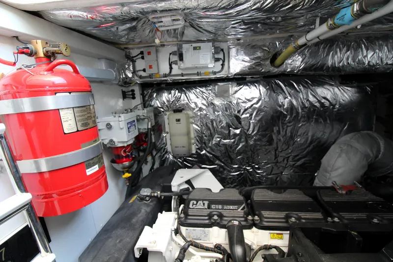 Slide: The Image of Engine room of 2013 Princess V62 yacht with CAT engine and fire extinguisher. - 48