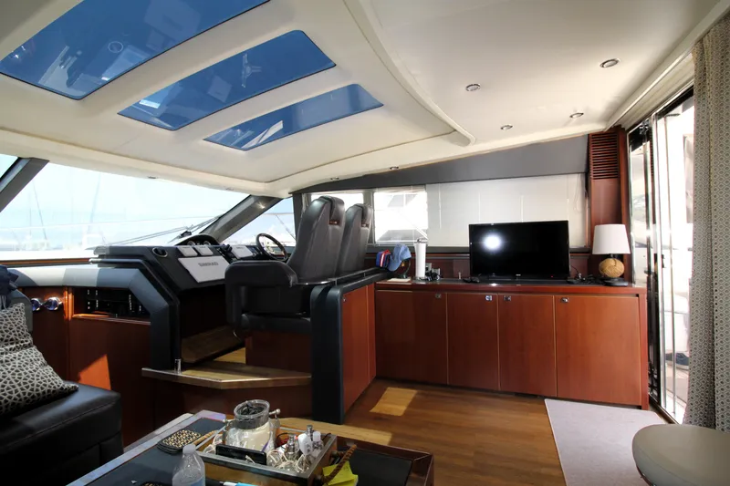 Slide: The Image of Luxurious interior of 2013 Princess V62 yacht with modern helm and entertainment area. - 9