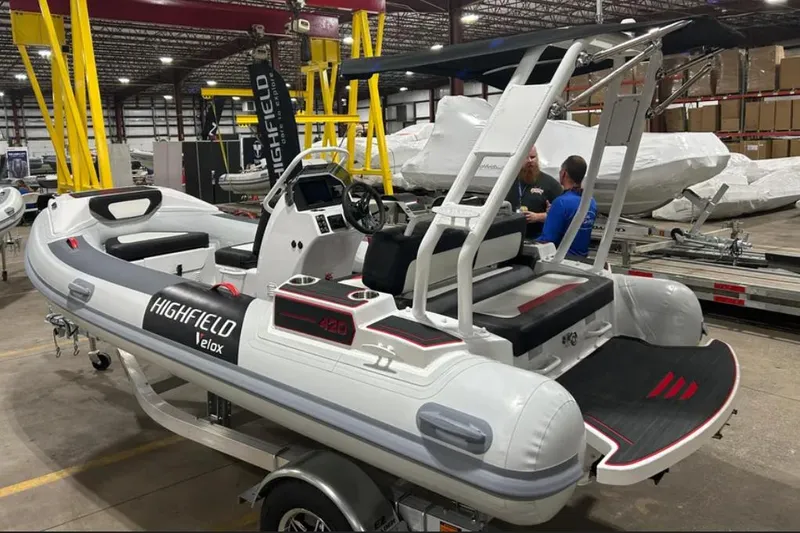 Slide: The Image of 2025 Highfield Velox 420 inflatable boat in a warehouse setting. - 2