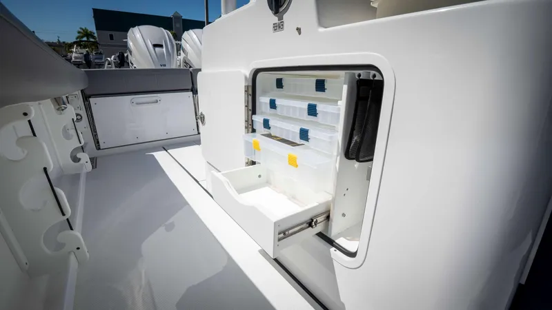 Slide: The Image of 2025 Everglades 335 CC boat with organized storage compartments and sleek design. - 16