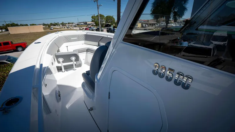 Slide: The Image of 2025 Everglades 335 CC boat with sleek design and spacious seating. - 27
