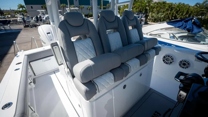 Slide: The Image of Luxurious seating on 2025 Everglades 335 CC boat, featuring plush gray upholstery and modern design. - 28