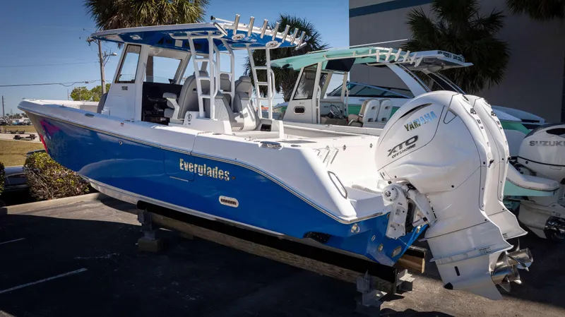 Slide: The Image of 2025 Everglades 335 CC boat with Yamaha engines, displayed outdoors. - 3