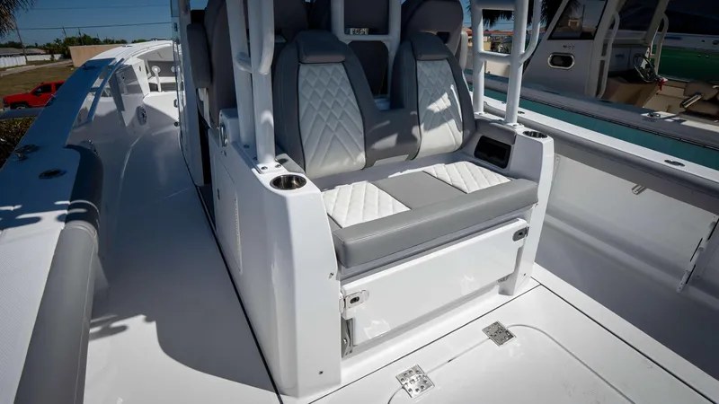 Slide: The Image of 2025 Everglades 335 CC boat interior with modern seating and sleek design. - 33