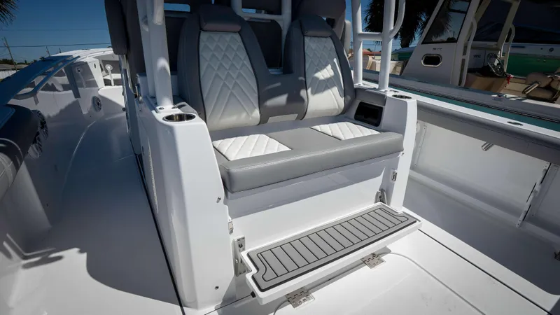 Slide: The Image of 2025 Everglades 335 CC boat interior with cushioned seating and sleek design. - 35