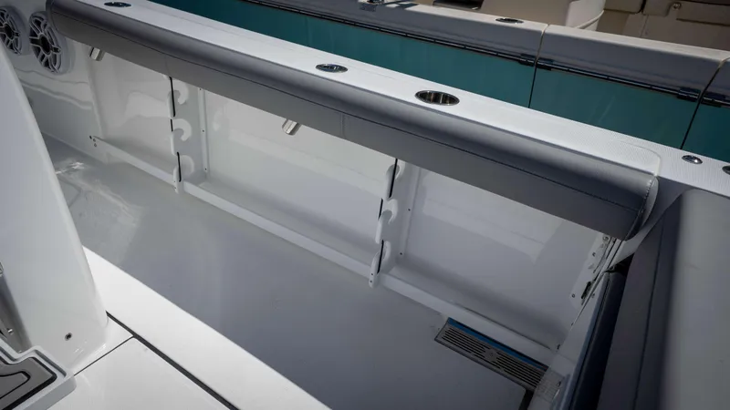 Slide: The Image of 2025 Everglades 335 CC boat interior with seating and cup holders. - 36