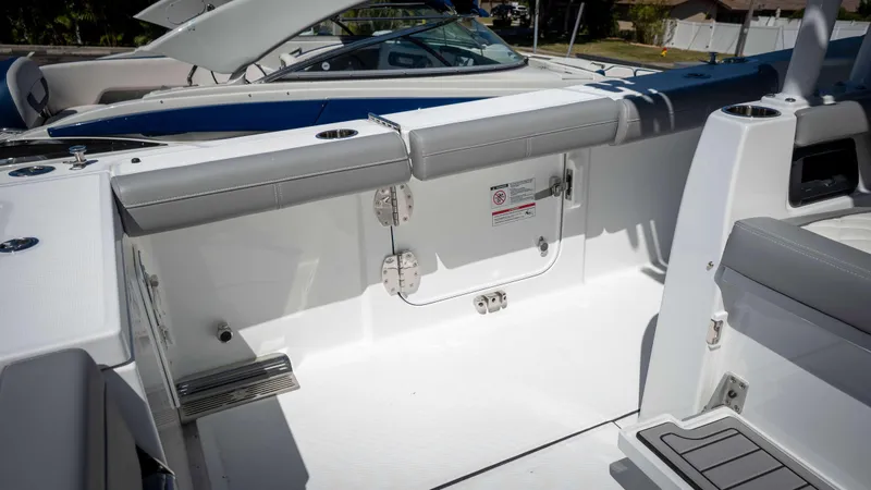 Slide: The Image of 2025 Everglades 335 CC boat interior with sleek seating and modern design. - 37