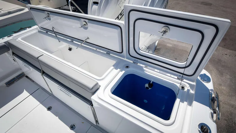 Slide: The Image of 2025 Everglades 335 CC boat with open storage compartments and seating. - 45