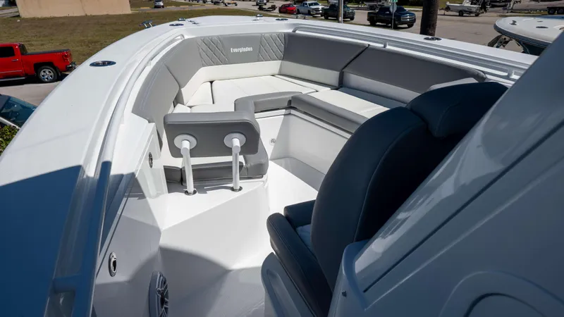 Slide: The Image of 2025 Everglades 335 CC boat interior with cushioned seating and modern design. - 9