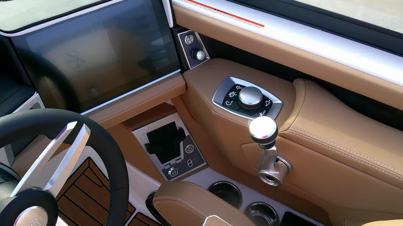 Slide: The Image of 2025 MasterCraft X24 boat dashboard with touchscreen and control panel. - 7