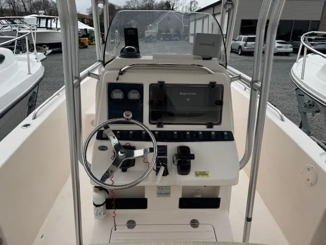 Slide: The Image of 2005 Grady-White Fisherman 222 boat console with steering wheel and navigation equipment. - 6