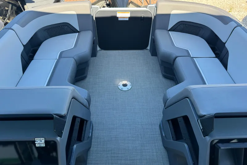 Slide: The Image of 2024 Manitou 22' Cruise Max Switchback interior with spacious seating and modern design. - 11