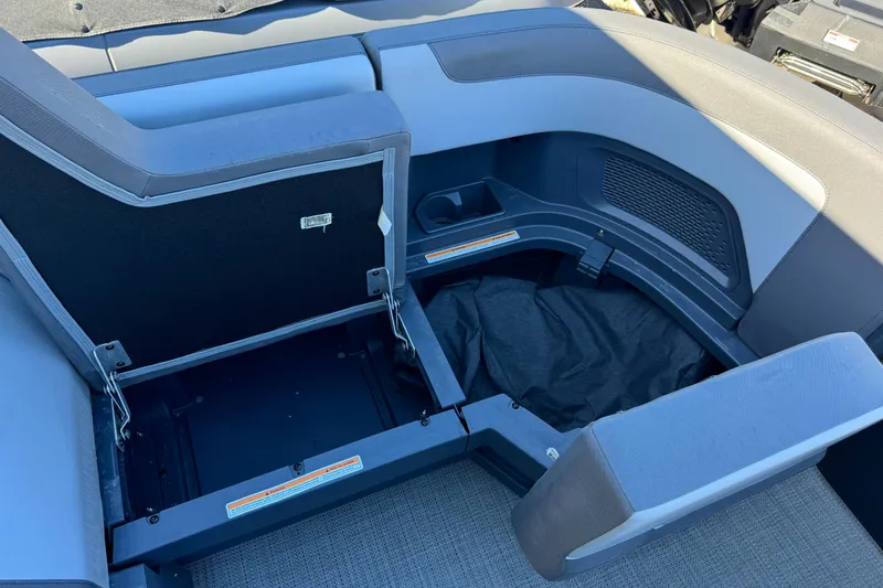 Slide: The Image of 2024 Manitou 22' Cruise Max Switchback boat interior storage compartment. - 14