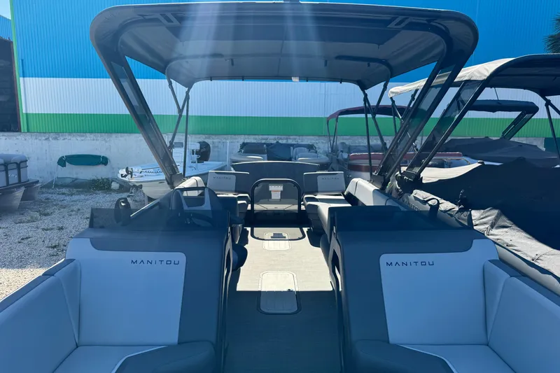 Slide: The Image of 2024 Manitou 22' Cruise Max Switchback pontoon boat with spacious seating and canopy. - 15