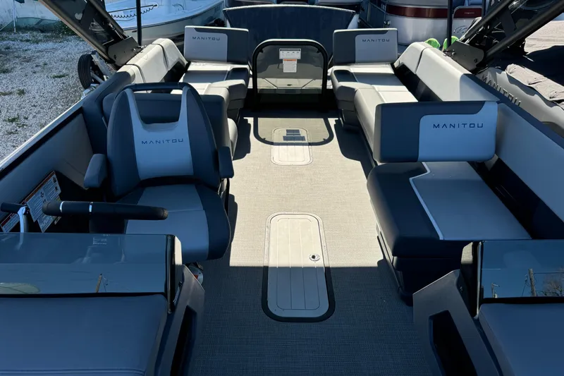 Slide: The Image of 2024 Manitou 22' Cruise Max Switchback interior with spacious seating and modern design. - 7